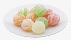 斑马条纹盘子放在白色盘子里的彩色糖果豆高清图片