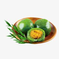 盘子上的食物青团黄色盘子里的青团绿叶装饰高清图片