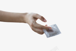 阻止受孕银色性保健品手指夹着的避孕套橡高清图片